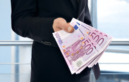 Businessman holding money - Euro (EUR)