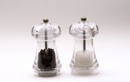 rock salt and pepper grains in a hand-grinding mills for shaded backgrounds
