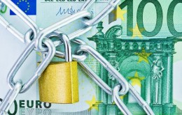 European currency with a chain and lock