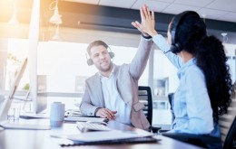 Business people, call center and high five for winning, teamwork or success in customer service at the office. Employee consultants touching hands in celebration for team win, bonus or promotion